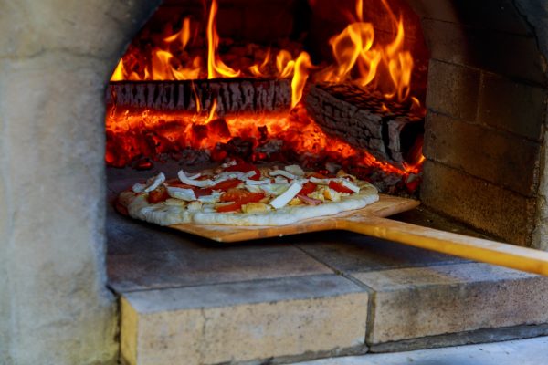 pizza cooked in a wood oven Pizza cooking in a tradition oven